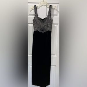 Black velvet gown with beaded top and matching bolero jacket.